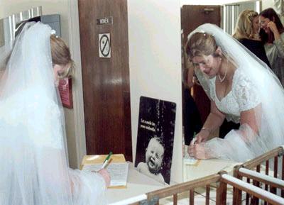 Donna signs the marriage license